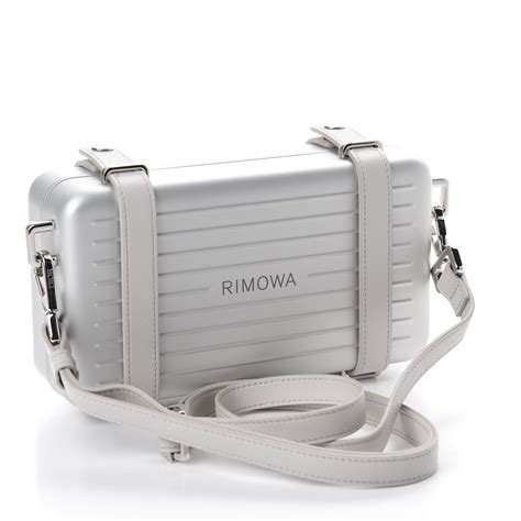 dior x rimowa personal clutch|christian Dior silver strap clutch.